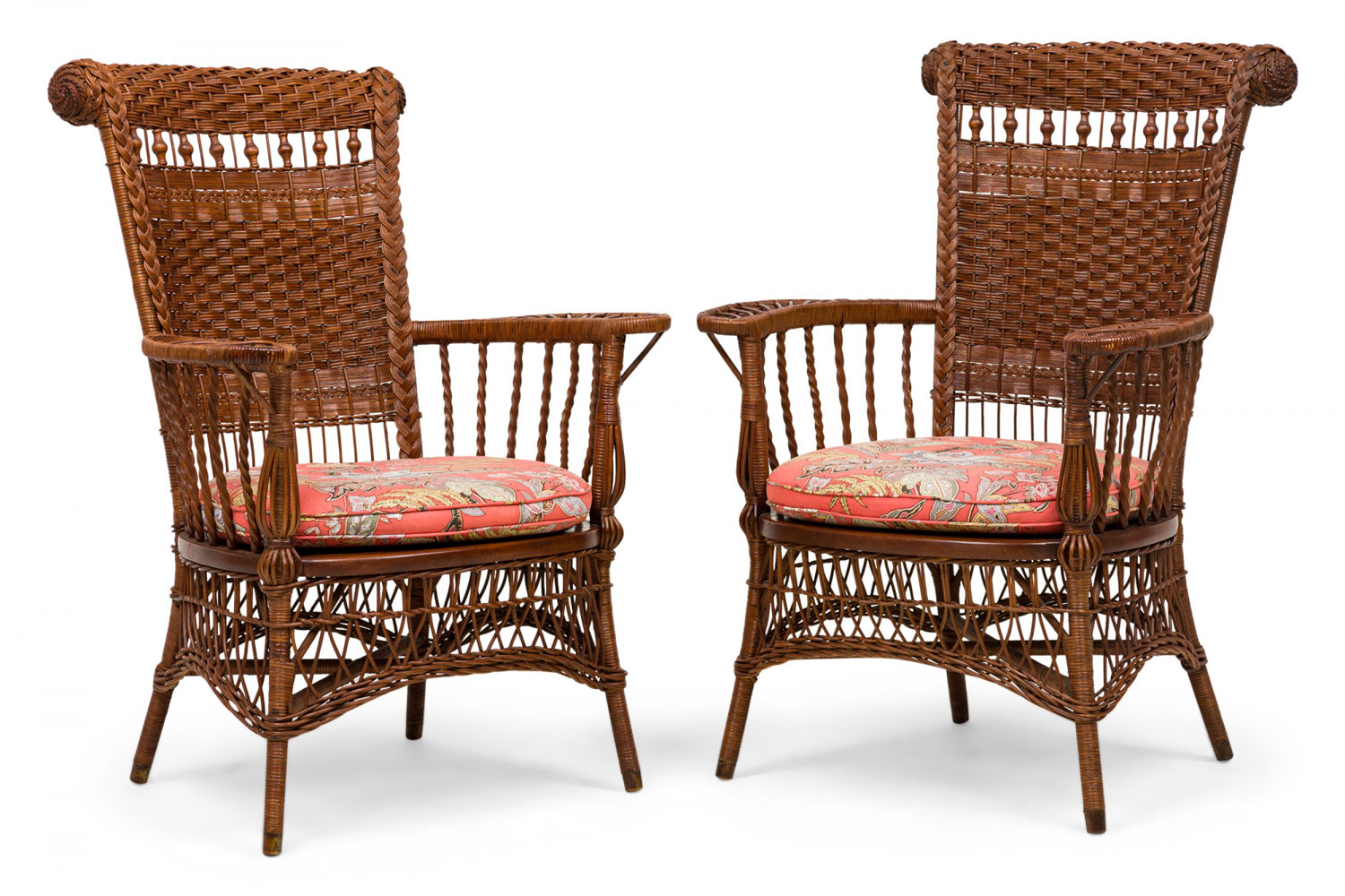 Pair of american victorian wicker armchairs with semi openwork turned backs and floral cushions