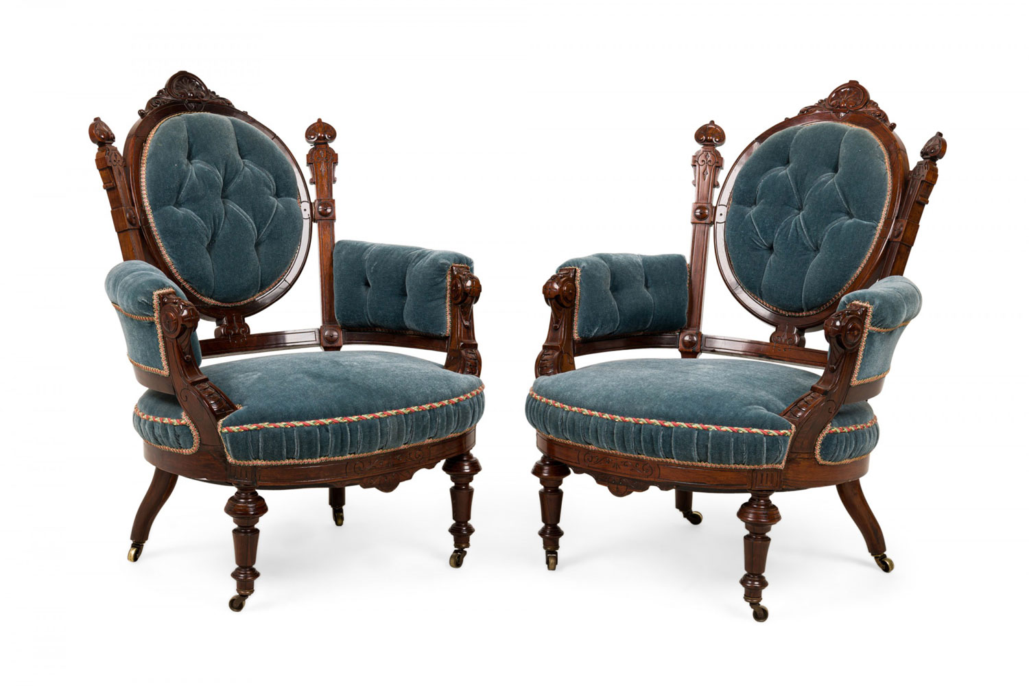 Pair of american victorian carved rosewood and tufted powder blue velvet armchairs