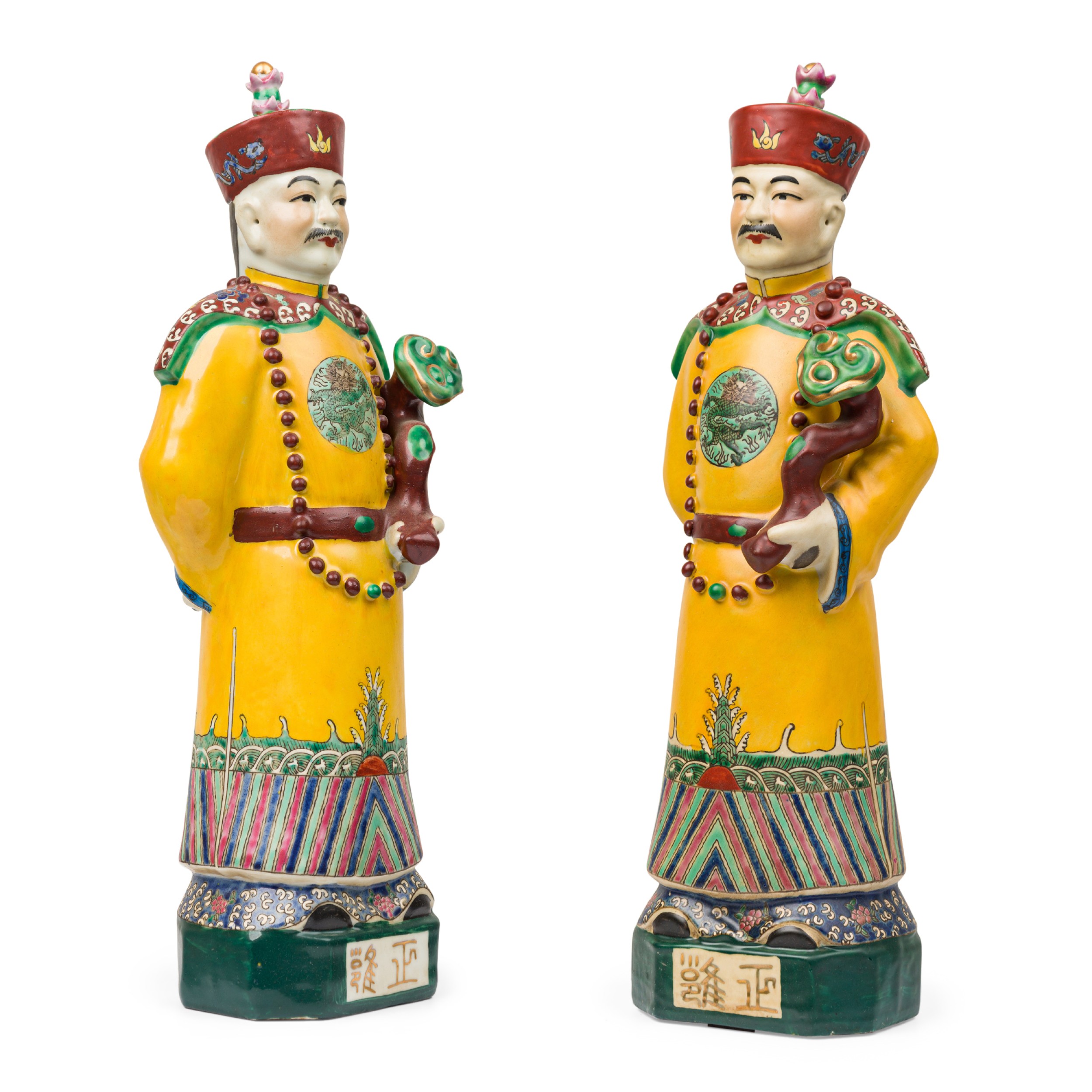 Pair of chinese painted ceramic figures depicting a yellow robed emperor