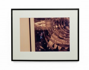 Double exposure color photograph of interior with tv