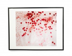 Detail color photograph of red confetti