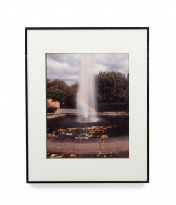 Vintage color photograph of fountain in a park with rainbow