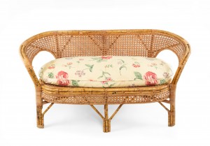 Wicker love seat with floral upholstery