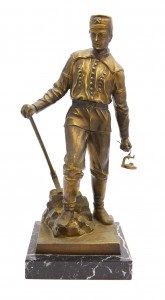 Metal statuette on a marble base