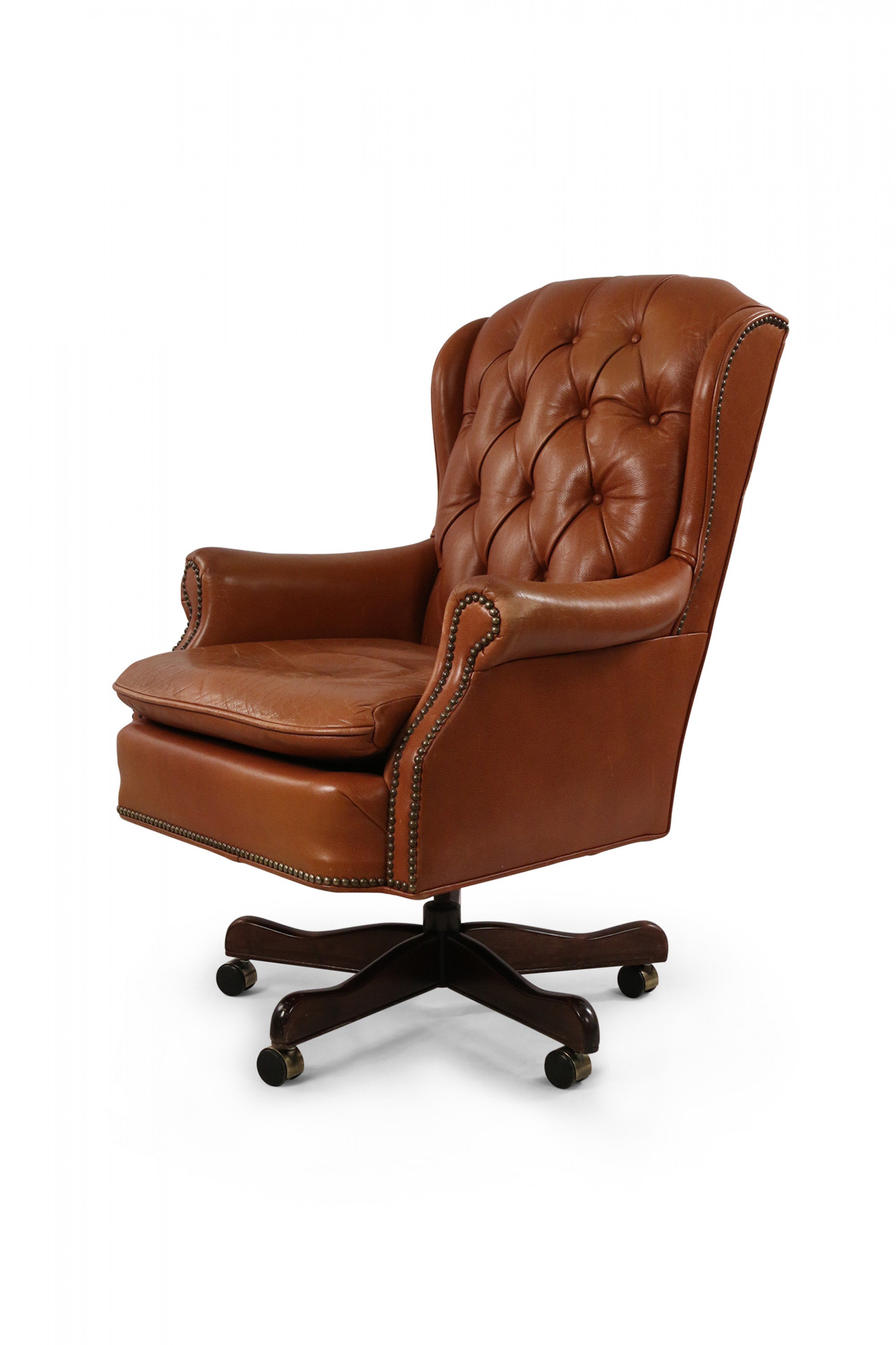 Mid century american brown tufted leather swivel office armchair