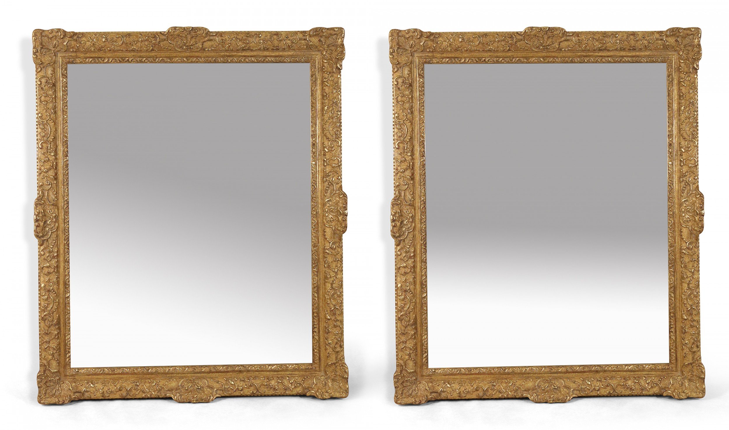 Pair of large french regence carved giltwood wall mirrors