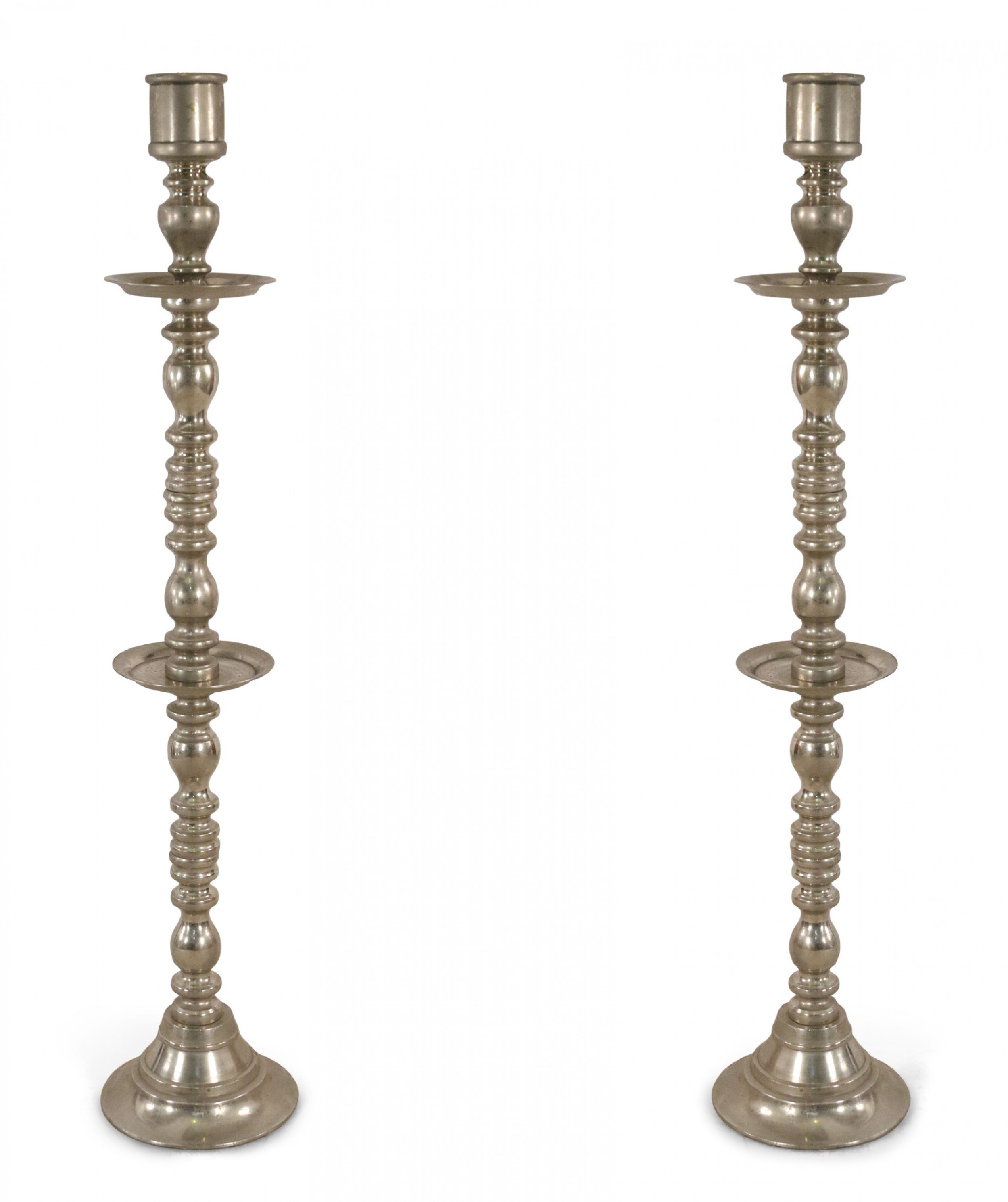 Pair of mid century silver metal turned design floor torchiere candle holders