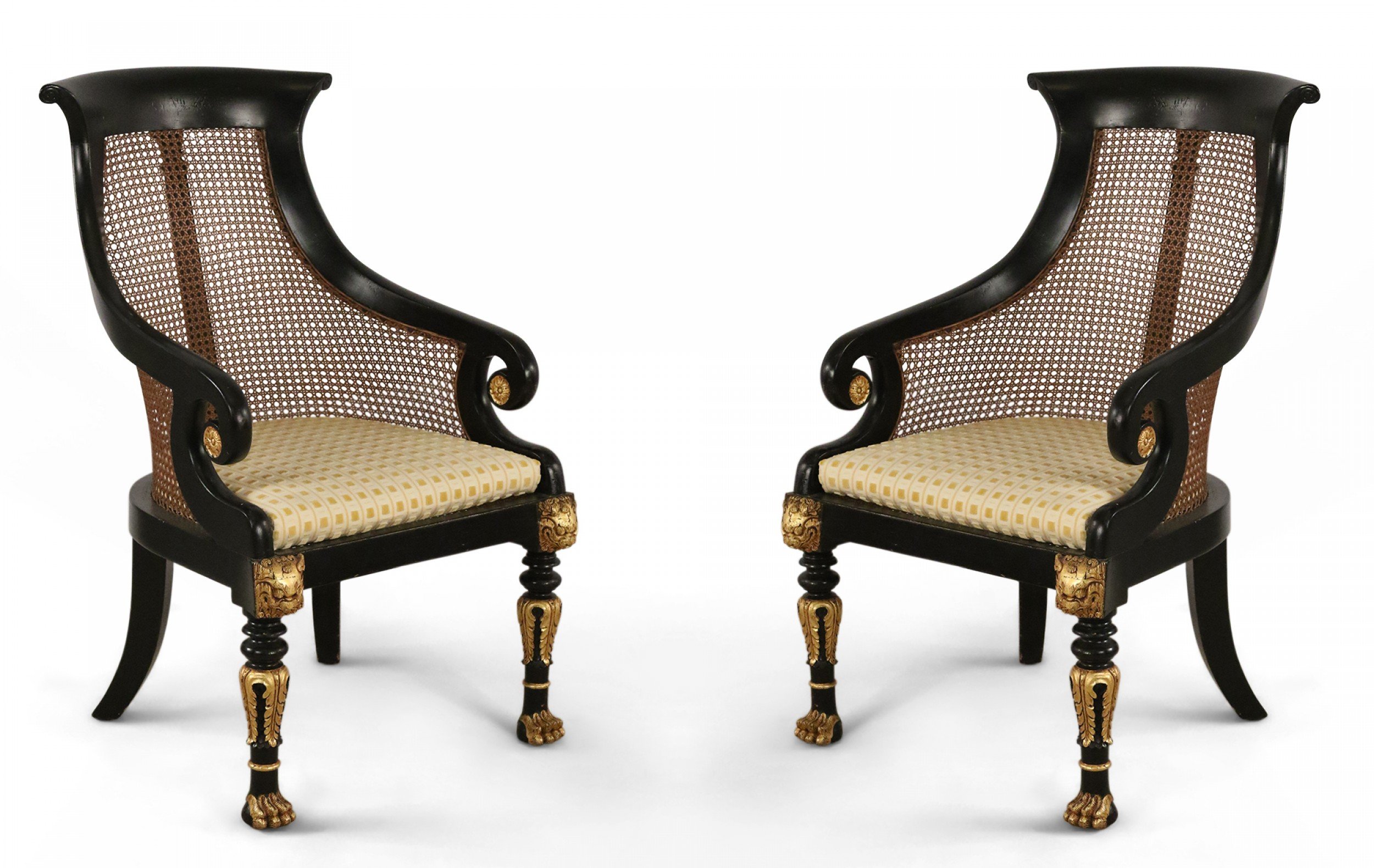 Pair of English Regency Style Carved Black and Gilt Cane Back Armchairs