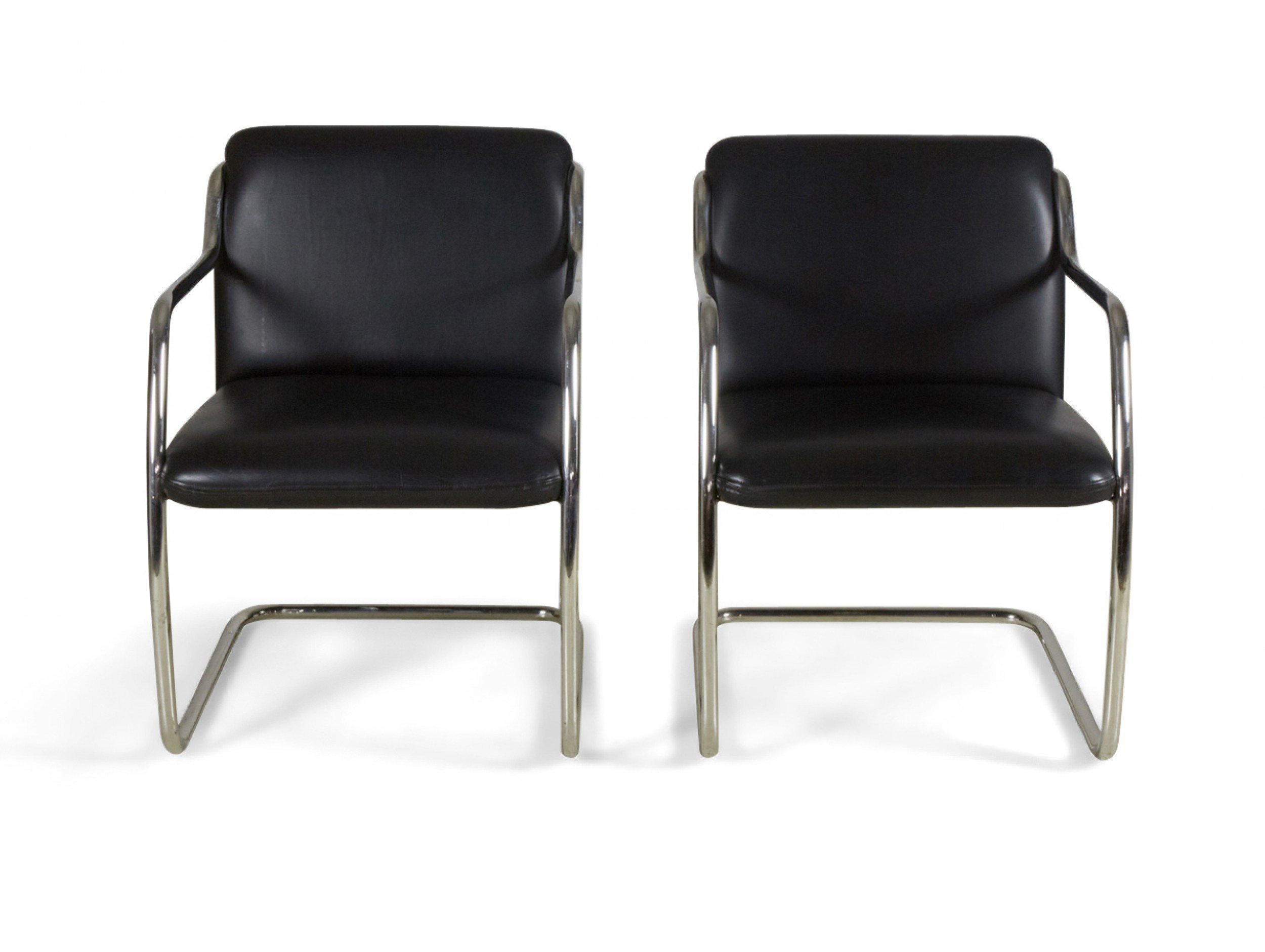 Pair of brueton contemporary black leather and steel tube frame armchairs