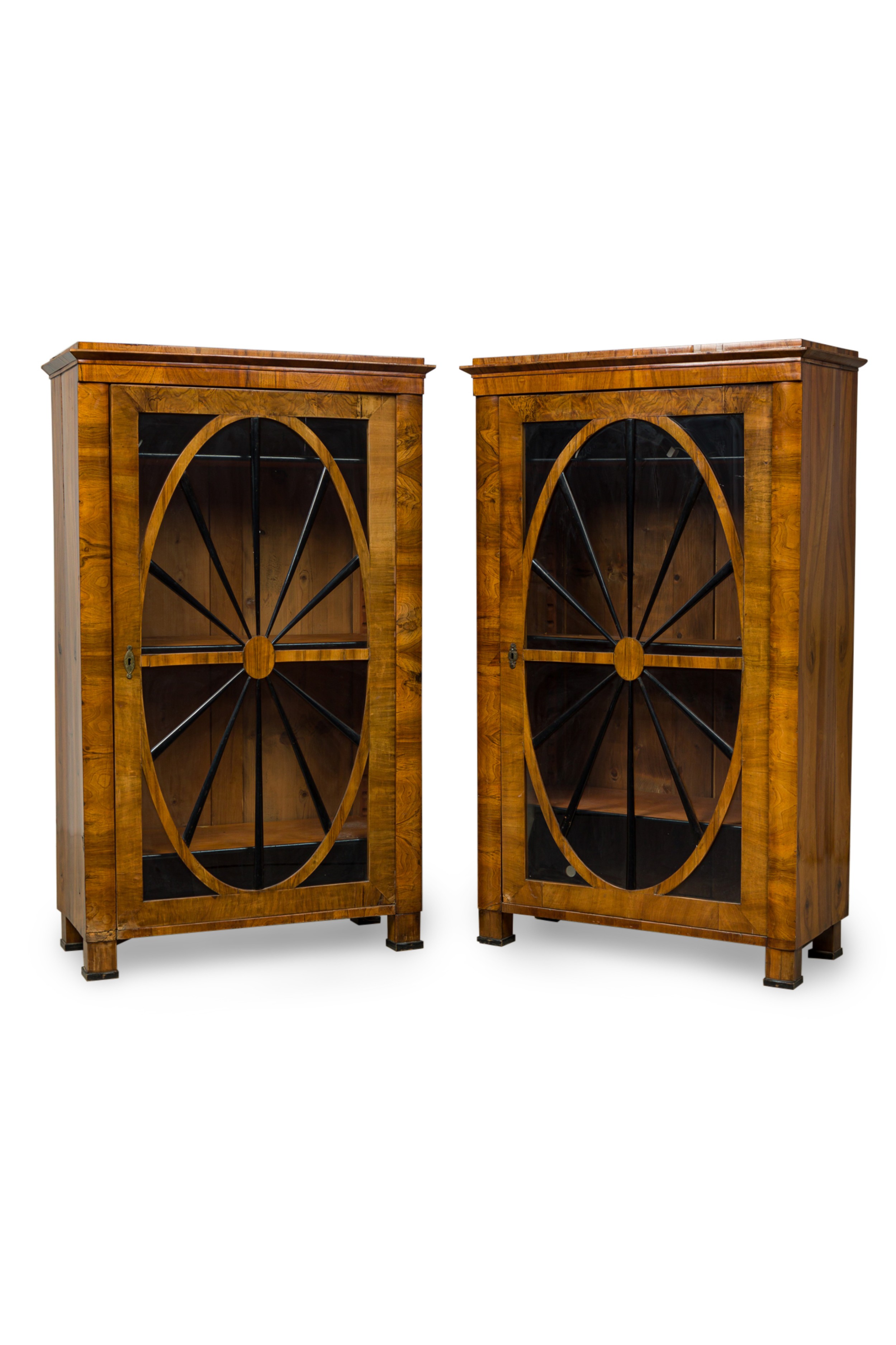 Pair of biedermeier walnut and ebonized wood glass door book cabinets