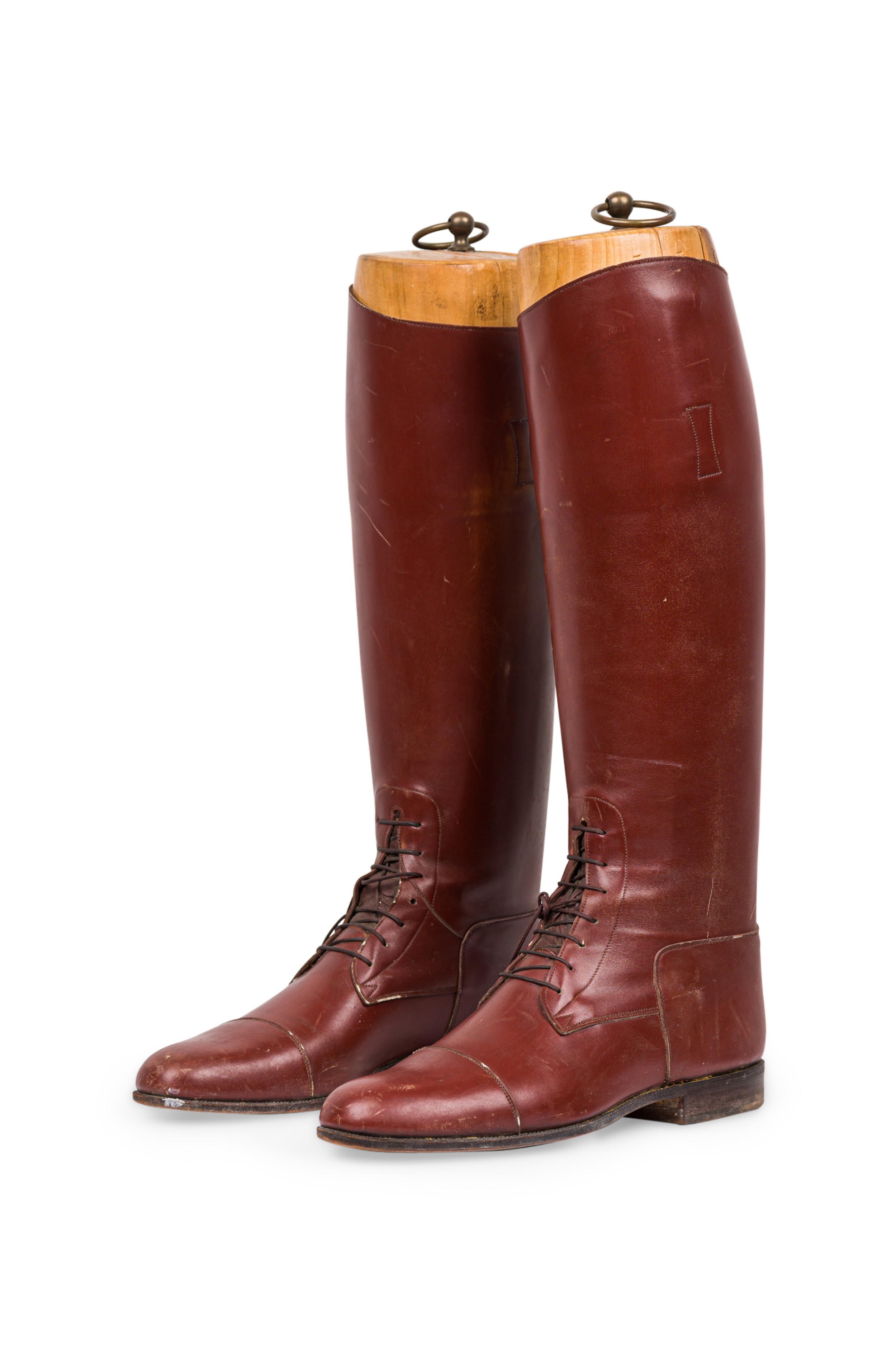 Vintage equestrian riding boots with wooden stretcher