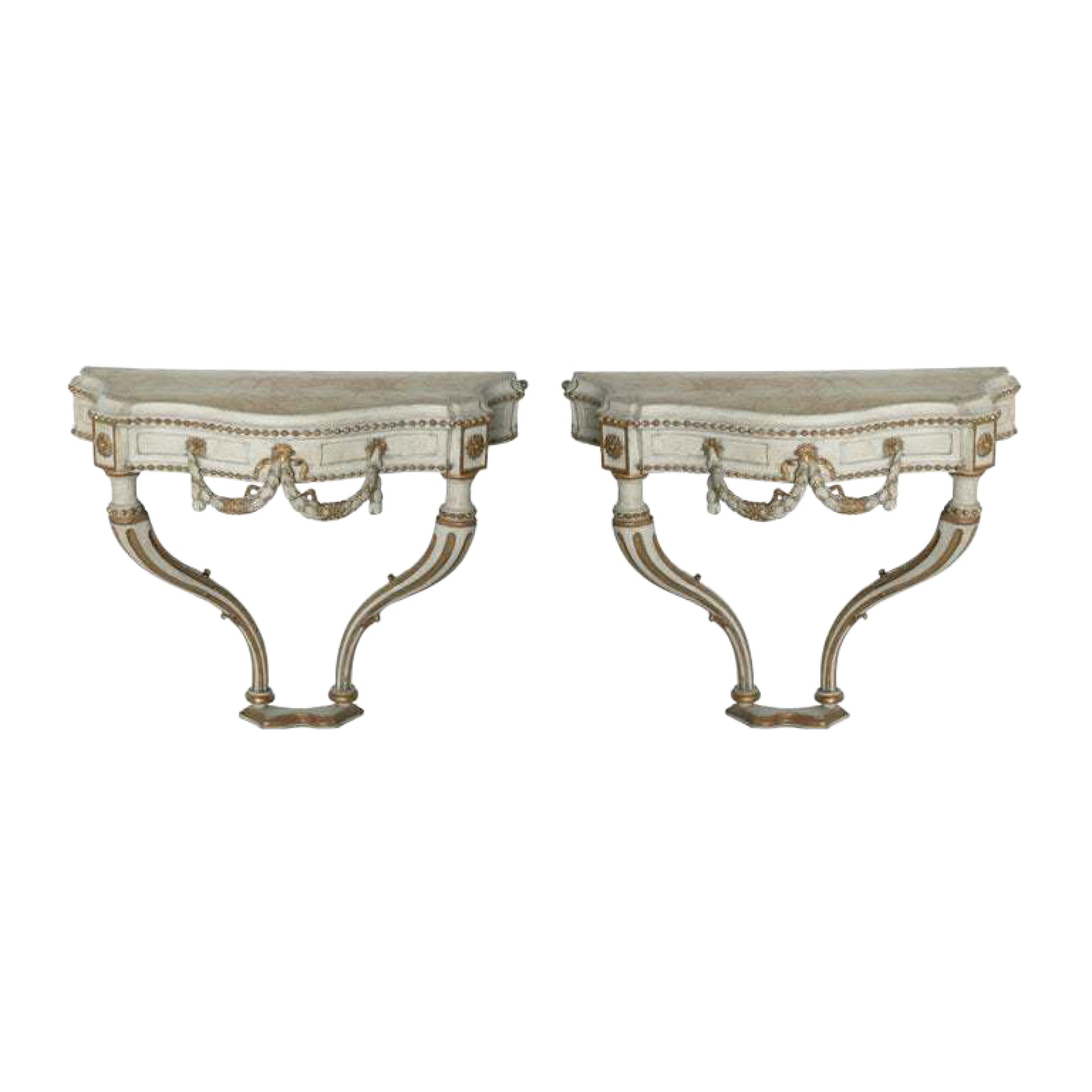 Pair of italian neo classic cream painted parcel gilt and carved wall mounted console tables