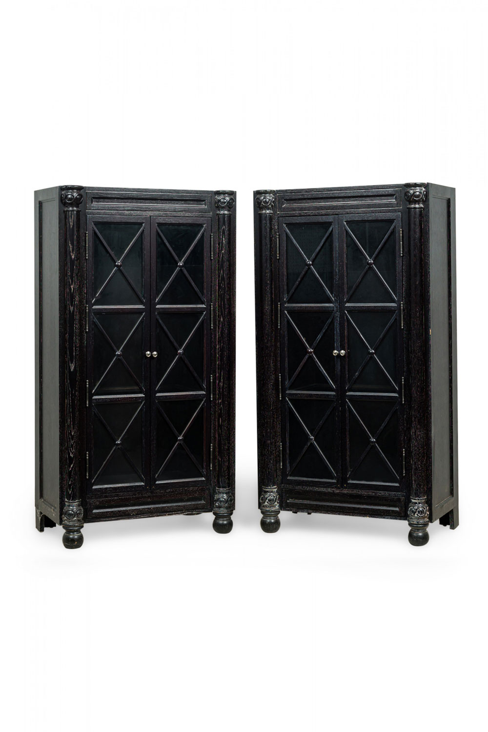 Pair of american empire style black cerused glass front cabinets