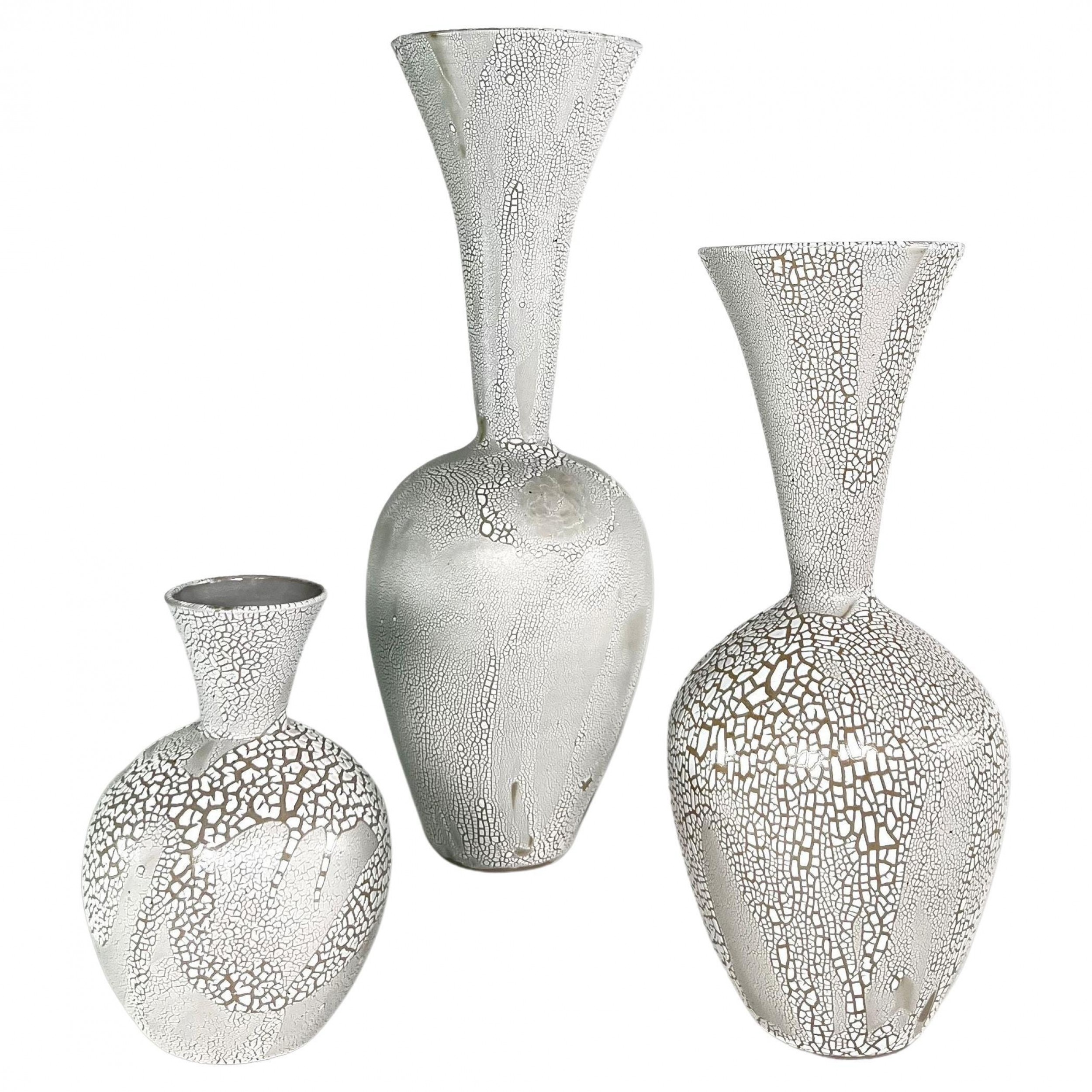 A group of 3 white mottled glazed ceramic vessels daric harvie