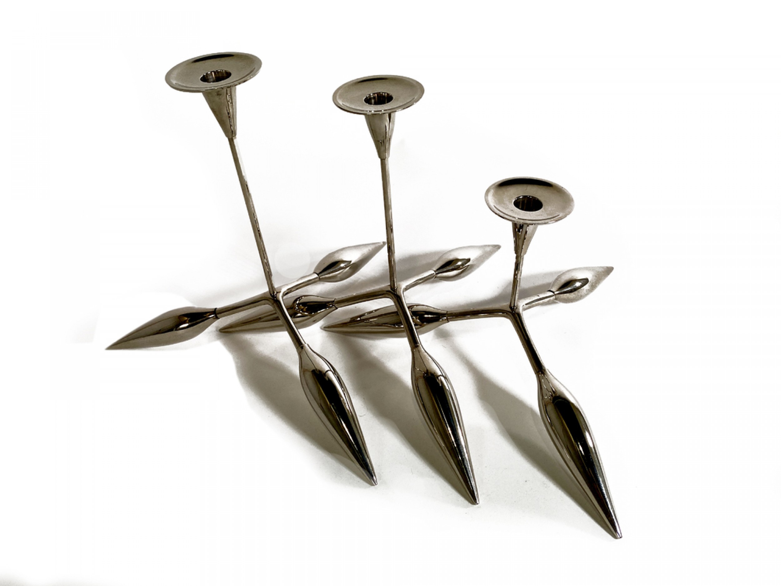 A set of 3 italian modern chrome candle sticks