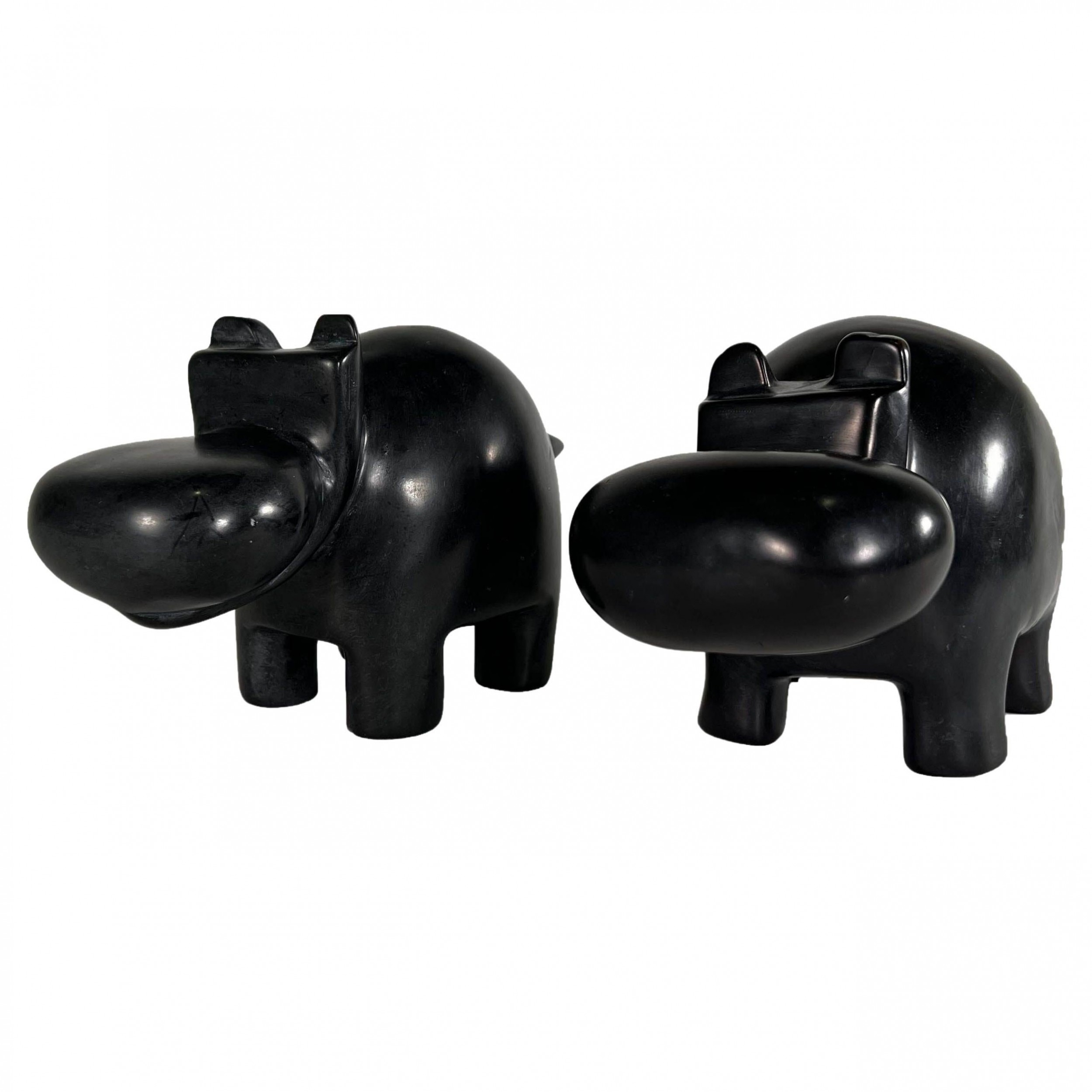 Matched pair of italian marmo negro marble hippos