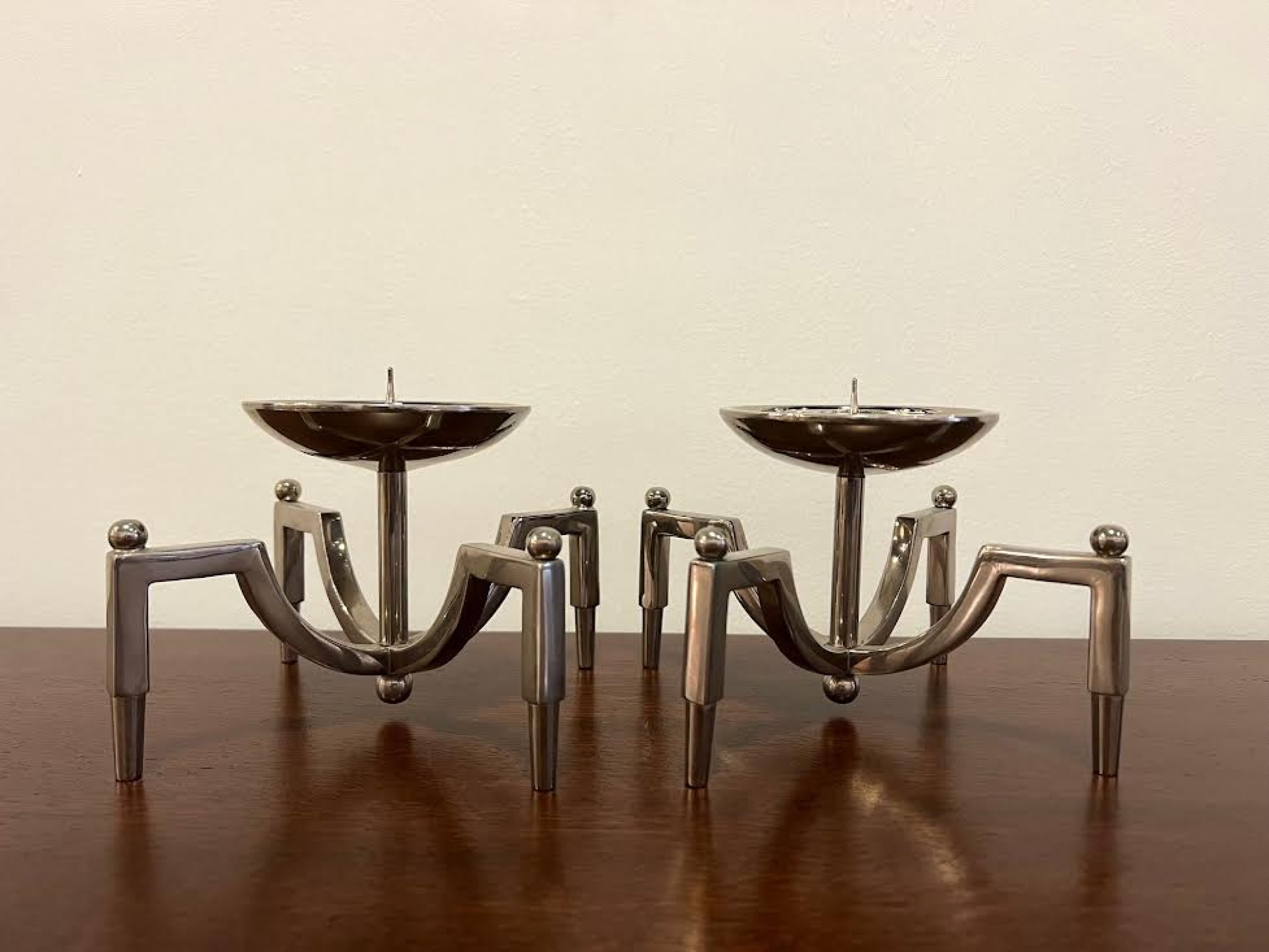 Pair of contemporary nickel candle holders