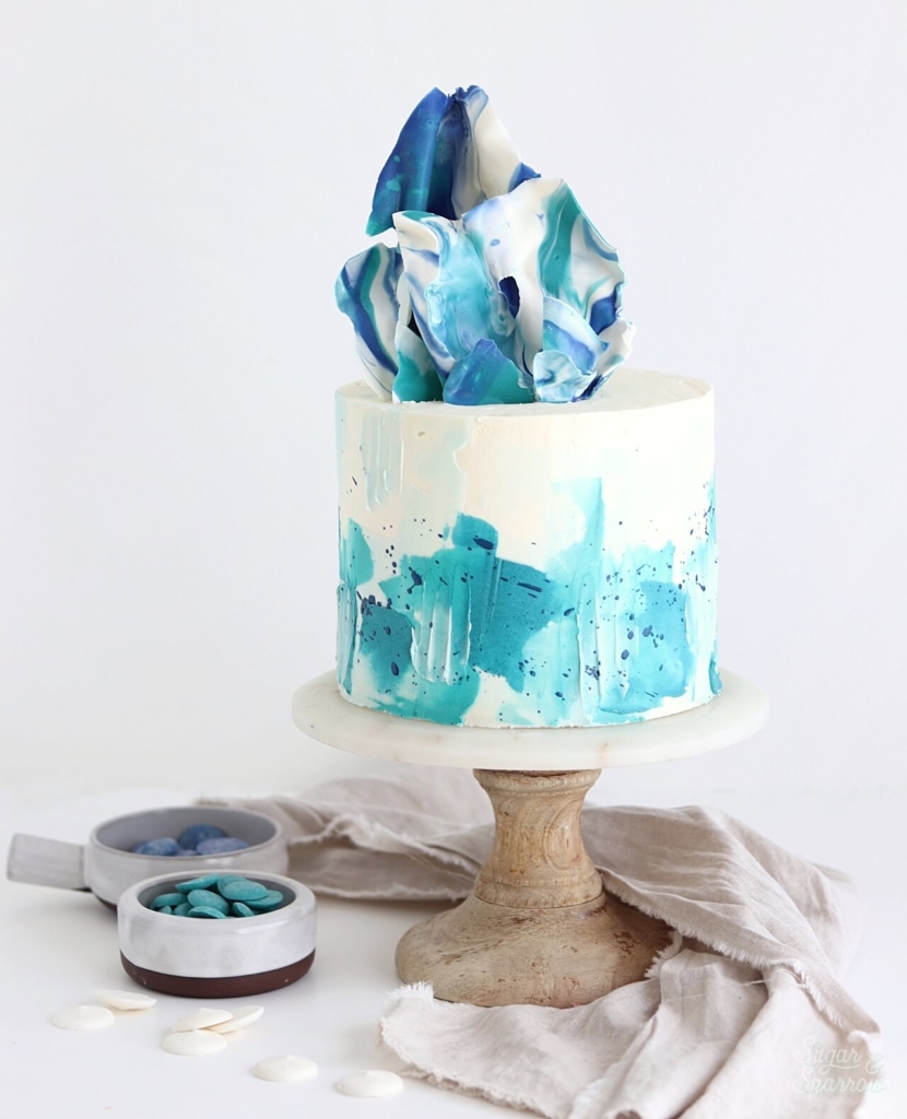 white chocolate sail cake by sugar and sparrow