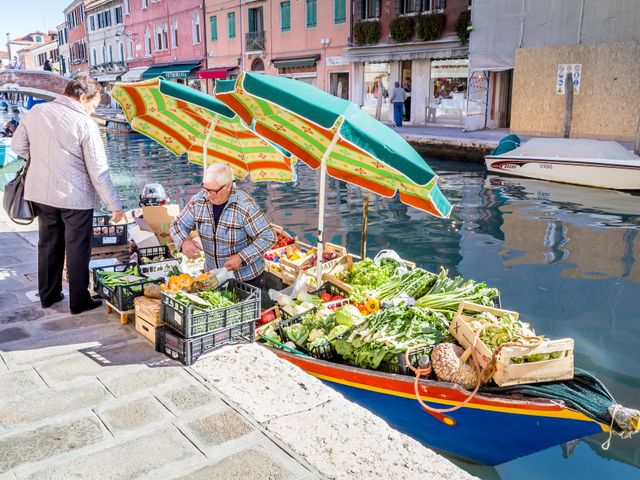 a small food boat in Murano