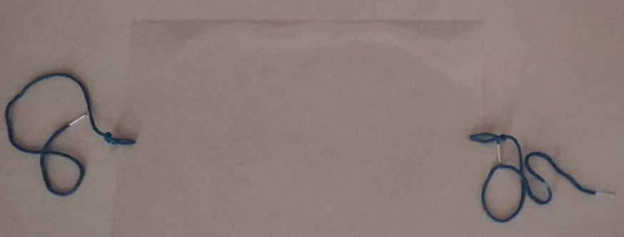Plastic sheet with strings to be used as face mask shield