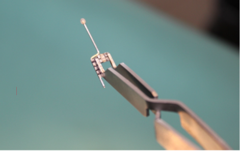 Bracket held with the bracket placement tweezer