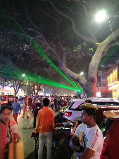 Recreational use of green lasers during a road show in a busy city street