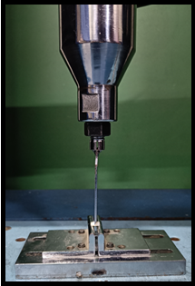 Two point test with universal testing machine (cross head speed: 1mm/min Distance support: 7mm)