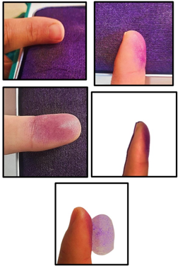 Distal phalanges rolled on an ink pad and fingerprints imprinted on the paper.