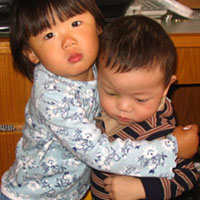 A loving brother and sister embrace.