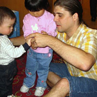 Daddy showing the kids incorrect Ring-Around-The-Rosie procedure.