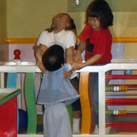 Olivia and her friends practice feats of strength.