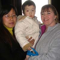 Ma ma, Olivia and the orphanage director.