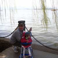 Ma ma and Olivia add to the scenic nature of West Lake.