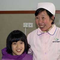 Olivia and one of her caregivers.