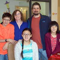 The happy Congiusta family return to Yangzhou orphanage.
