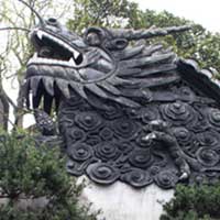Children pose under a dragon.