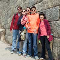 Our first family portrait by a Great Wall.