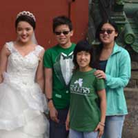 Funny, I don't remember inviting those kids in the green shirts to our wedding.