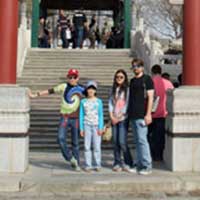 Standing under a gate for the umpteenth time on our trip.