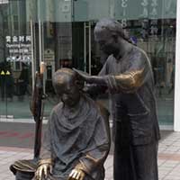 A couple of guys with haircuts just like King Arthur has.