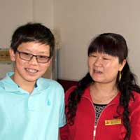 Matthew with the woman who took care of him for the first year of his life.