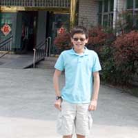 Matthew outside the old orphanage and his previous home.