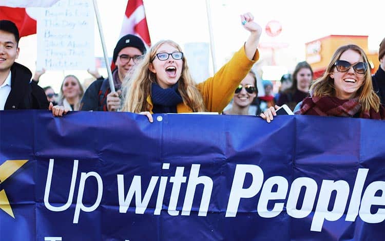 up with people cast member marching for social action and change