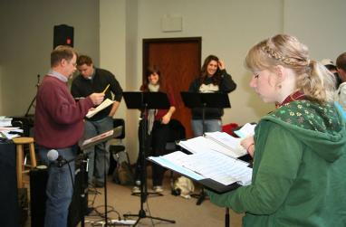 Picture of Ken Bohannon teaching music students.