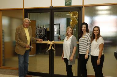 Picture of President John Feaver, Misty Steele, Kelli Monroe and Taylor Jackson at the ribbon cutting ceremony for USAO's new Student Success Center.