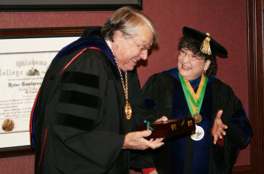 Retiring professor Nancy Warden jokes around with university president John Feaver.