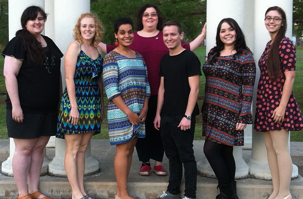 Theatre students pose with their sponsor in front of the Greek Theater.