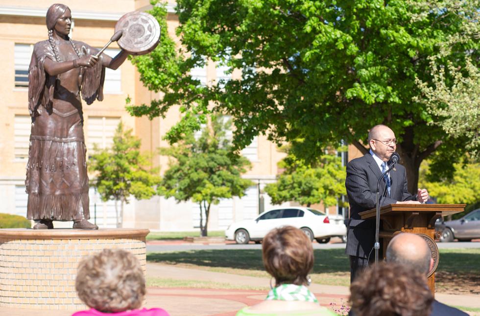 Chickasaw Nation Governor Bill Anoatubby delivers remarks on the legacy of Te Ata Thompson Fisher before a statue of her likeness erected at the University of Science and Arts of Oklahoma.