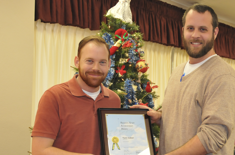 Tom Coker (left), computer technician at USAO, receives his Staff Achievement award from Adam Heilman, USAO Print Shop manager and the 2012-13 Employee of the Year. Tom Coker (left), computer technician at USAO, receives his Staff Achievement award from Adam Heilman, USAO Print Shop manager and the 2012-13 Employee of the Year.