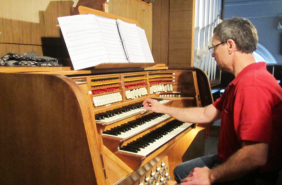 Dr. Stephen Weber prepares for a concert on a pipe organ installed in the Deák Ter Evangelikus Templom, an historic church, in Budapest, Hungary, during a recent tour of Eastern Europe.